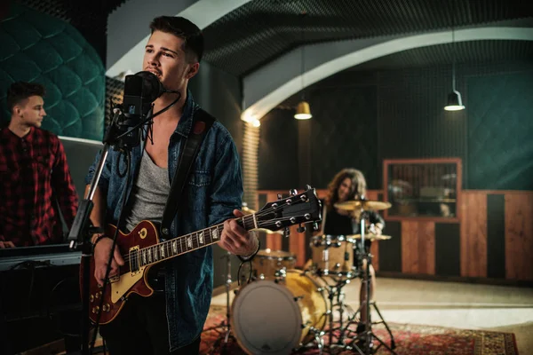 Music band having rehearsal in a studio — Stock Photo, Image