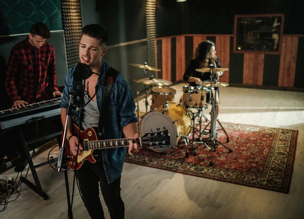 Music band having rehearsal in a studio — Stock Photo, Image