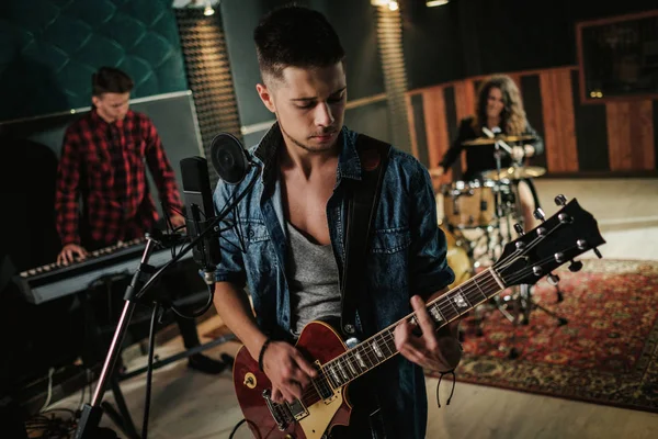 Music band having rehearsal in a studio — Stock Photo, Image