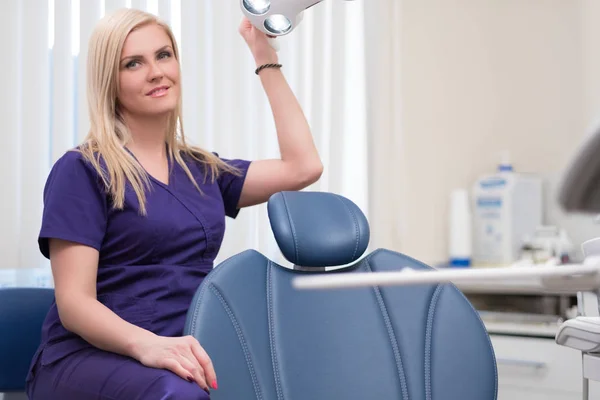 Young beautiful blond woman dentist at dentists surgery — Stock Photo, Image