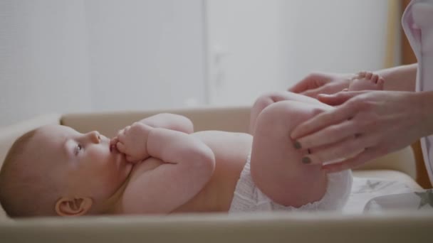 Baby boy getting a massage from masseuse — Stock Video