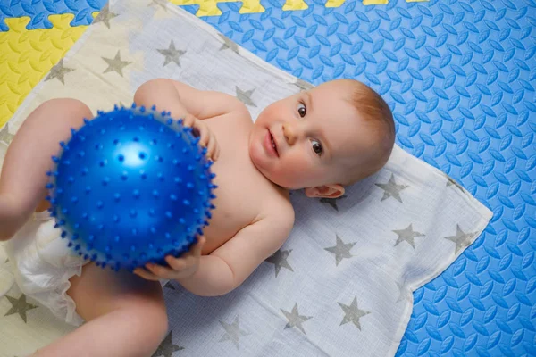 Baby boy getting massage with special equipment — Stock Photo, Image