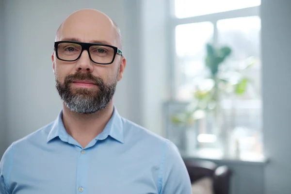 Bearded middle-aged man wearing glasses. — Stock Photo, Image