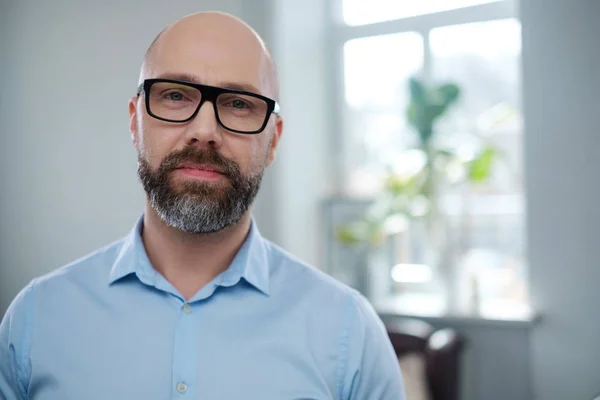Bearded middle-aged man wearing glasses. — Stock Photo, Image