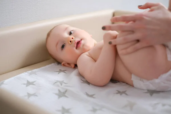 Baby boy getting a massage from masseuse — Stock Photo, Image