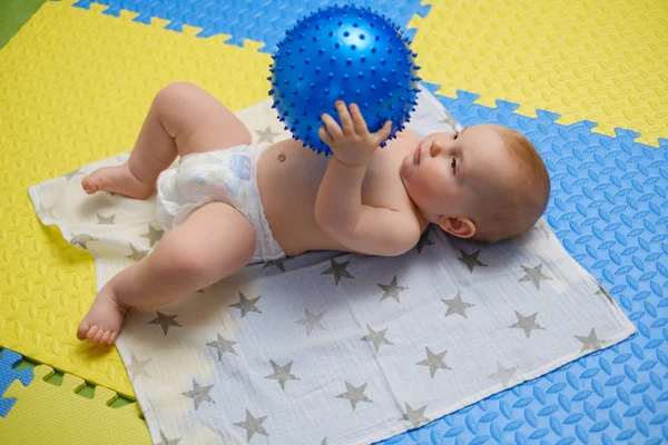 Baby boy getting massage with special equipment — Stock Photo, Image