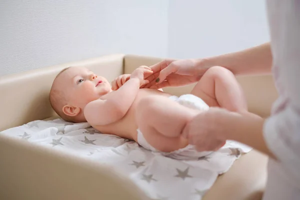 Baby boy getting a massage from masseuse — Stock Photo, Image