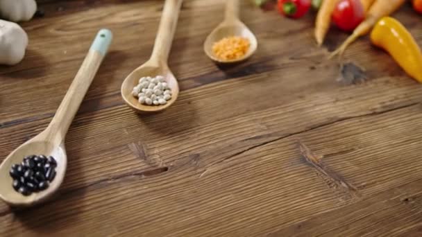 Assortment of fresh vegetables on wooden background — Stock Video