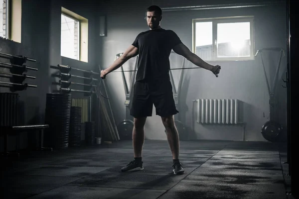 Sportive Man Stretch His Arms With Skipping Rope . — Stock Photo, Image