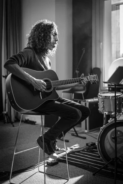 Curly Brunette Compose Melody With His Beautiful Guitar . — Stock Photo, Image