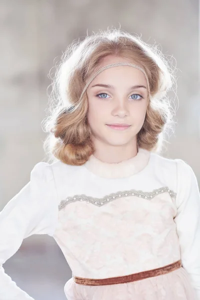 Charming little girl model posing in a studio. — Stock Photo, Image