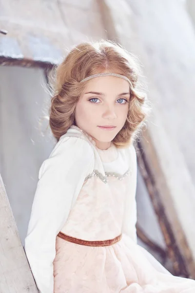 Charming little girl model posing in a studio. — Stock Photo, Image