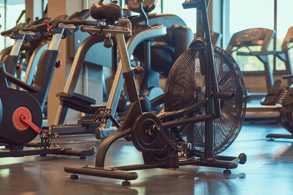 Interior of fitness hall with fitness bicycles.