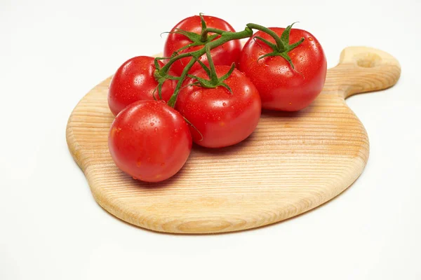 Several Tomatoes Lie Wooden Cutting Board Isolated White Background — Stock Photo, Image