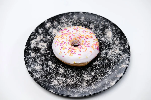 Appetizing Donut Sprinkles Lie Black Ceramic Plate Isolated White Background — Stock Photo, Image