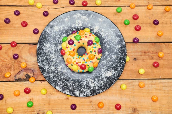 Appetizing Golden Donut Lie Ceramic Plate Sprinkled Colorful Chocolate Pellets — Stock Photo, Image