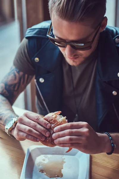 Close Portrait Hungry Hipster Guy Stylish Haircut Beard Sits Table — Stock Photo, Image