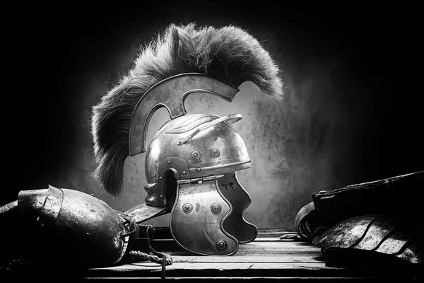 Complete combat equipment of the ancient Greek warrior lie on a box of wooden boards. — Stock Photo, Image
