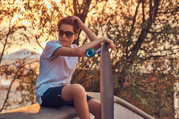 Young Skater Boy Sunglasses Dressed Shirt Shorts Sitting Stone Guardrail — Stock Photo, Image