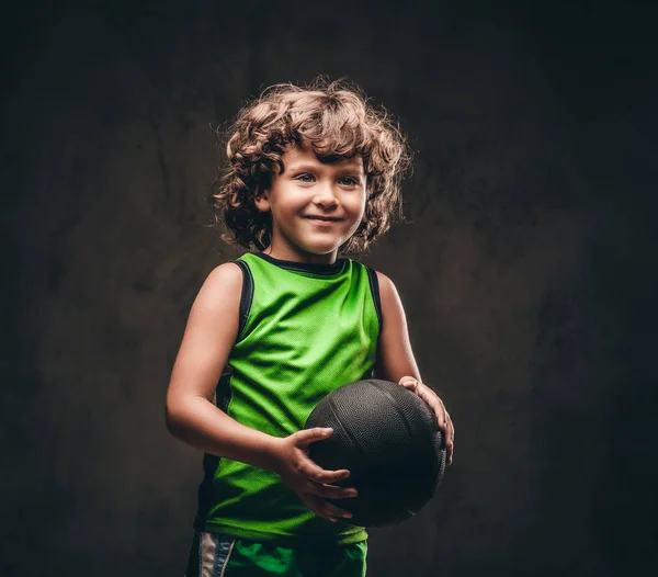 Little Basketball Player Sportswear Holding Ball Studio Isolated Dark Textured — Stock Photo, Image