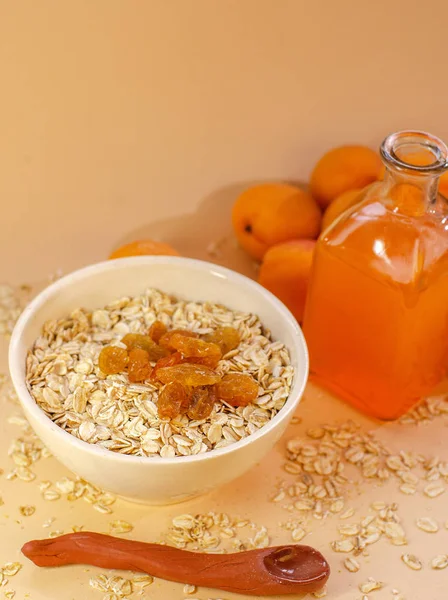 Healthy Breakfast White Plate Oatmeal Dried Apricots Glass Apricot Juice — Stock Photo, Image