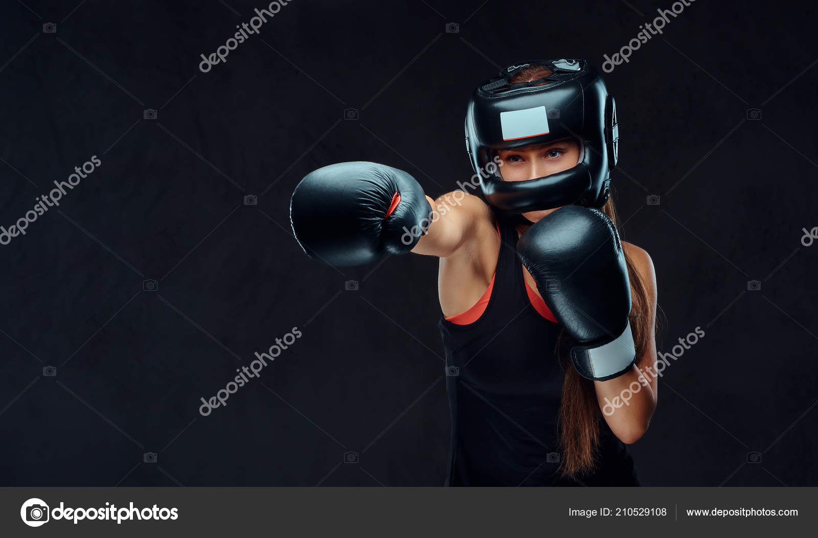 Sportive woman in sportswear wearing a protective helmet and