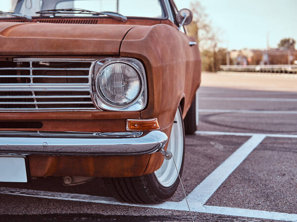 Cropped front view of a restored retro car.