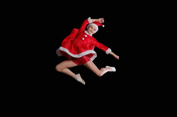 Natal, infância, conto de fadas. Uma menina vestindo um traje de Pai Natal está voando — Fotografia de Stock