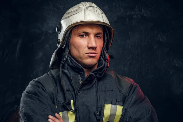 Manly firefighter in helmet looks into camera — Stock Photo, Image