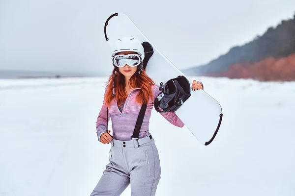 Norwegian girl wearing warm snowboard suit and goggles — Stock Photo, Image