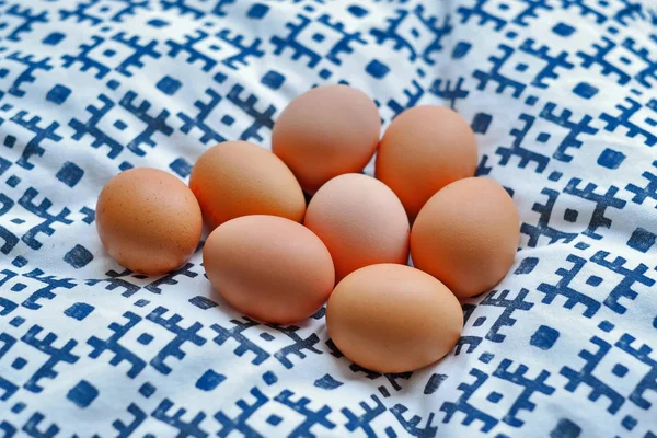 Rustic food. A set of chicken eggs lying on a cloth — Stock Photo, Image