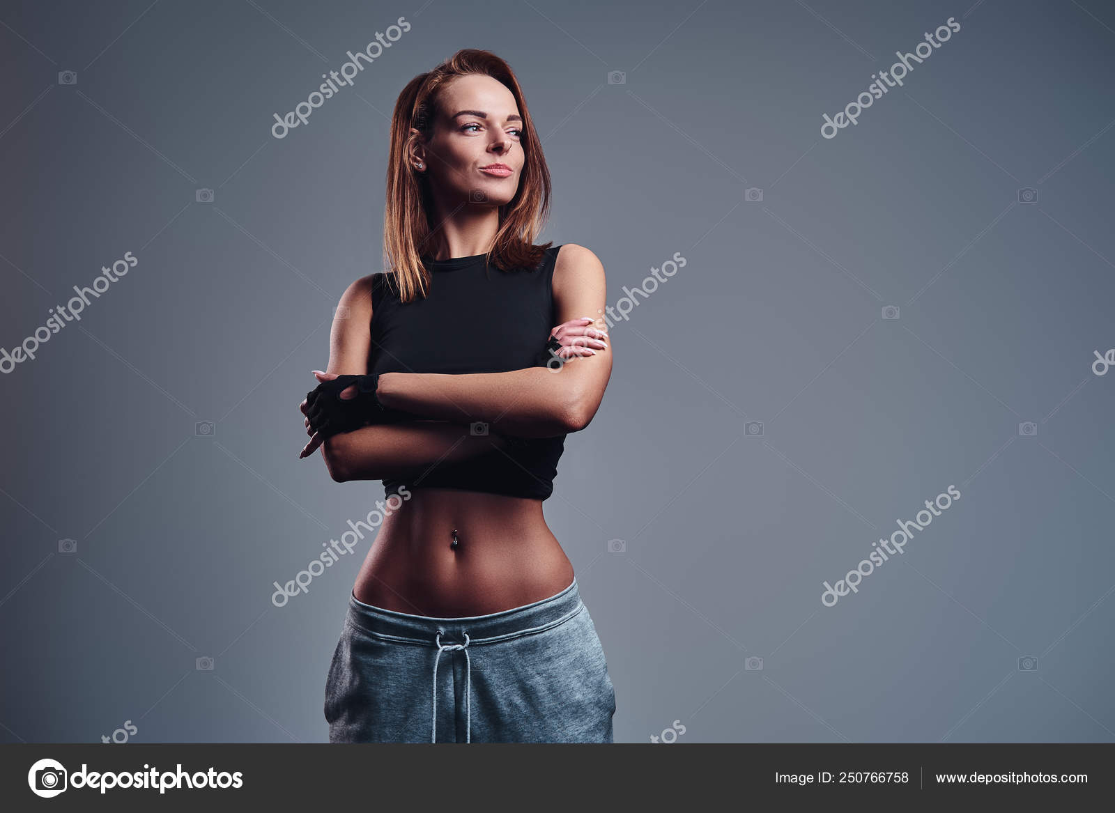 Confident Young Fit Woman In Sportswear Posing Free Stock Photo