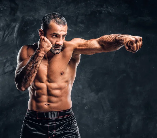 Professional fighter showing kick fighting technique. — Stock Photo, Image
