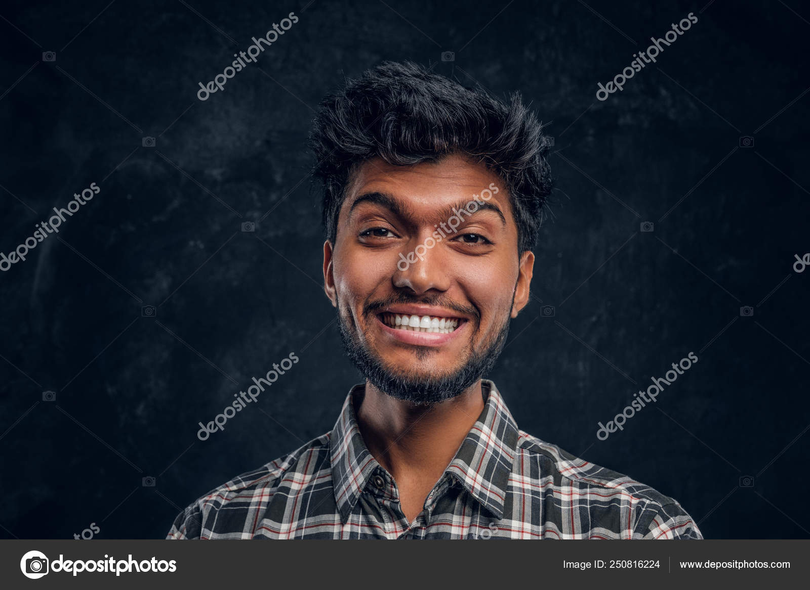 Close Up Portrait Of A Handsome Indian Man Wearing A Plaid Shirt