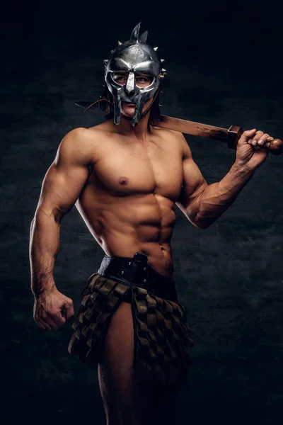 Powerful athlete with sword in his hands — Stock Photo, Image