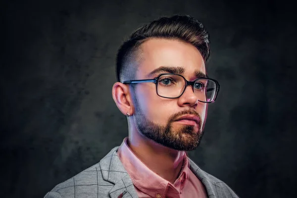 Portrait of attractive pensive man in checkered blazer, pink shirt and glasses — Stock Photo, Image