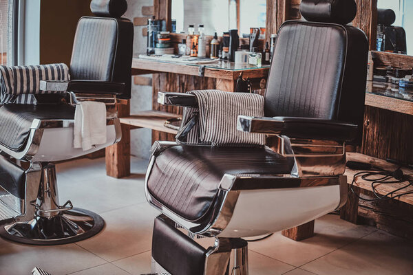 Interiour of luxury trandy barbershop in daylight.