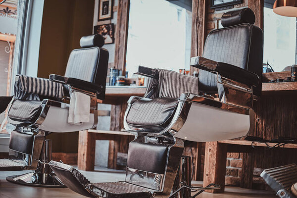 Interiour of luxury trandy barbershop in daylight.
