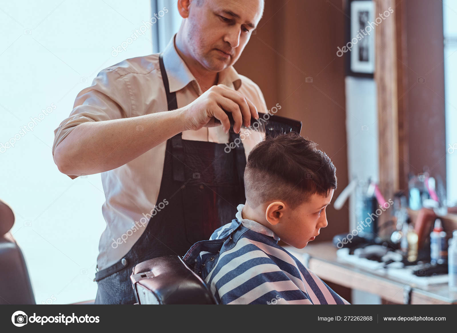 Small School Boy Is Getting Trendy Haircut From Expirienced Barber