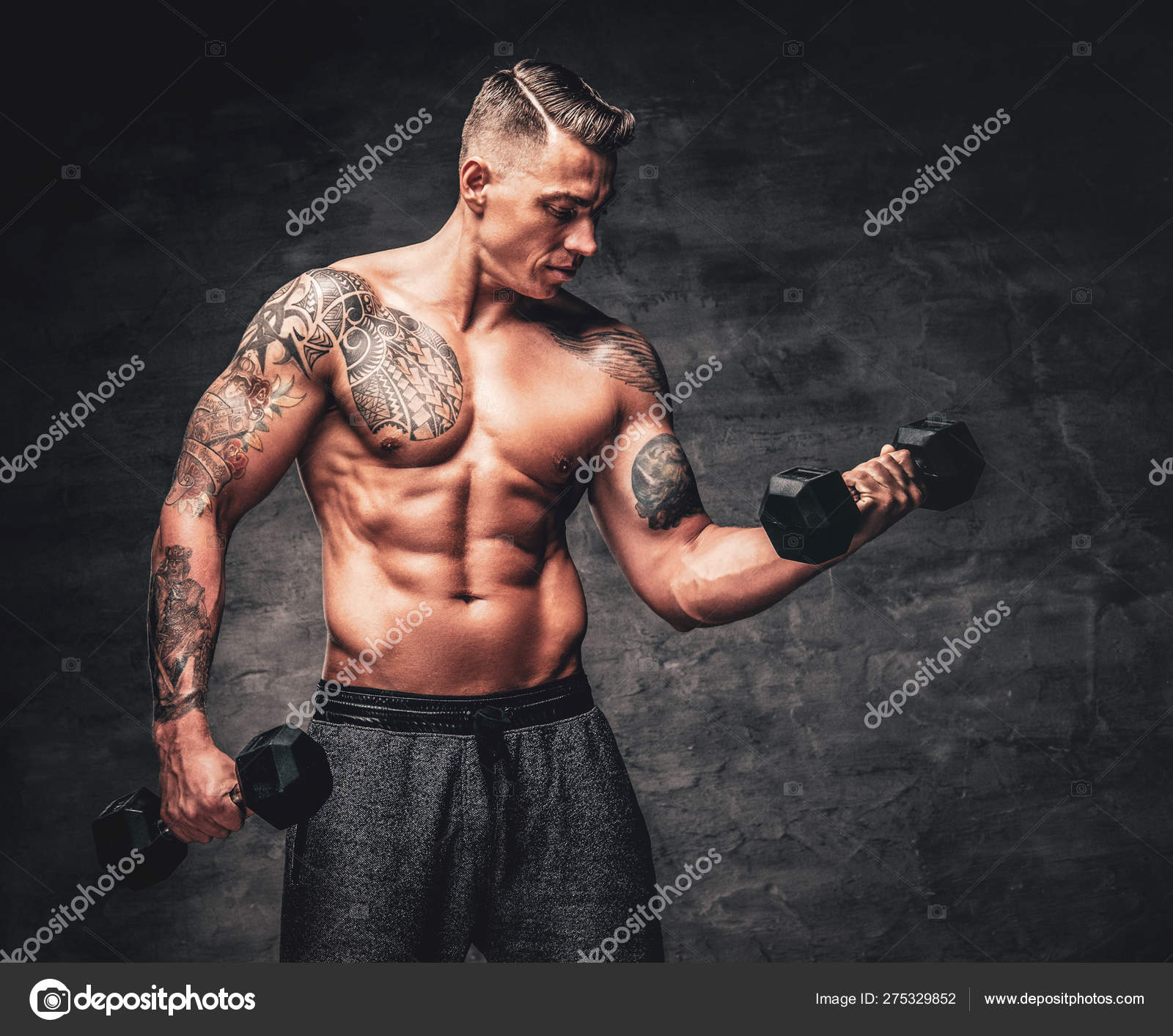 Athletic male with tattoo on his chest doing biceps workouts wi Stock Photo by ©fxquadro 275329852 Athletic male with tattoo on his chest doing biceps workouts wi Stock Photo by ©fxquadro 275329852