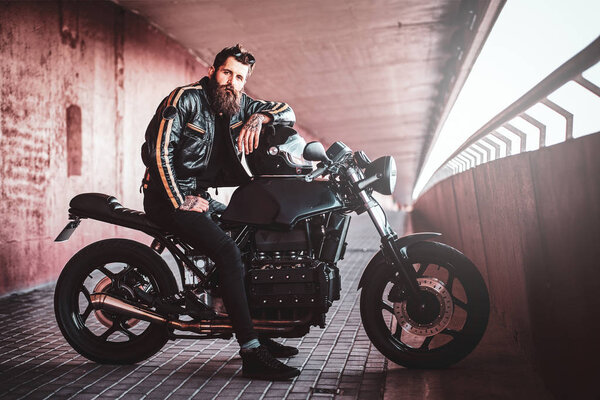 Expirienced man and his motorbikein the tunnel