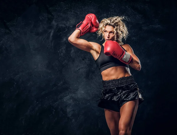 Portrait of professional female boxer in action — Stock Photo, Image