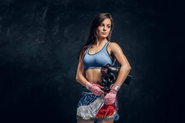 Portrait of pretty professional female boxer