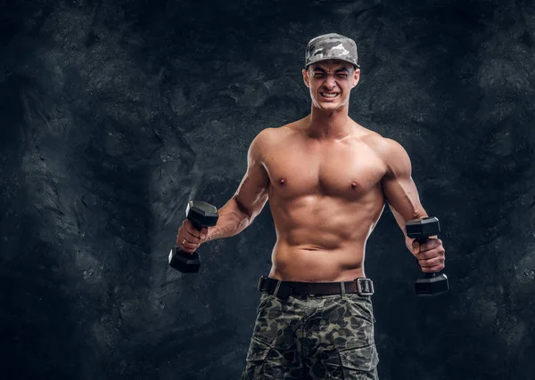 Portrait of shirtless muscular man over dark background — Stock Photo, Image