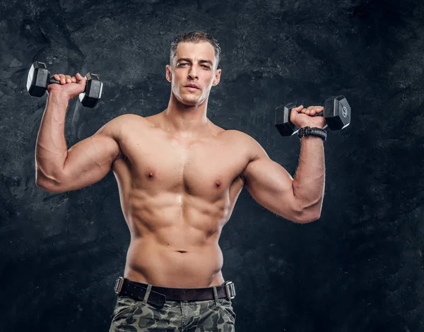 Portrait of shirtless muscular man over dark background — Stock Photo, Image