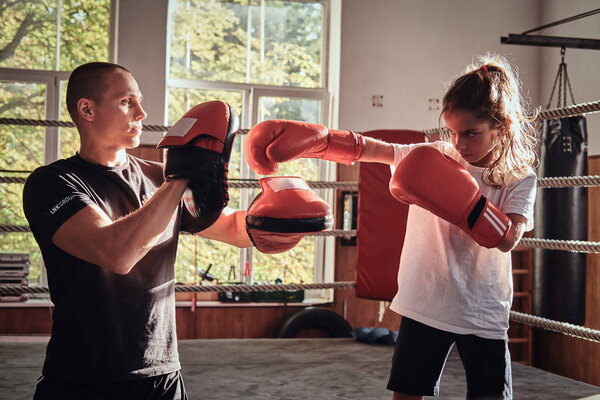 Training of little kick boxer girl