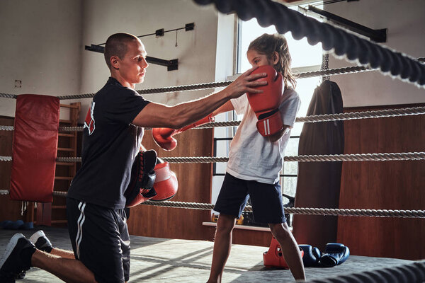 Training of little kick boxer girl