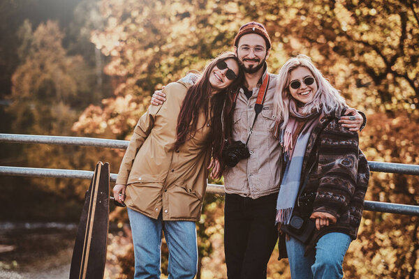 Beautiful people surrounded with yellow trees