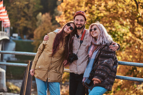 Beautiful people surrounded with yellow trees