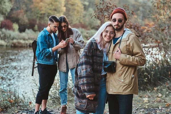 Group of stuents have a nise time at autumn forest — Stock Photo, Image